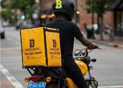 A Basilissa delivery rider on a motorbike