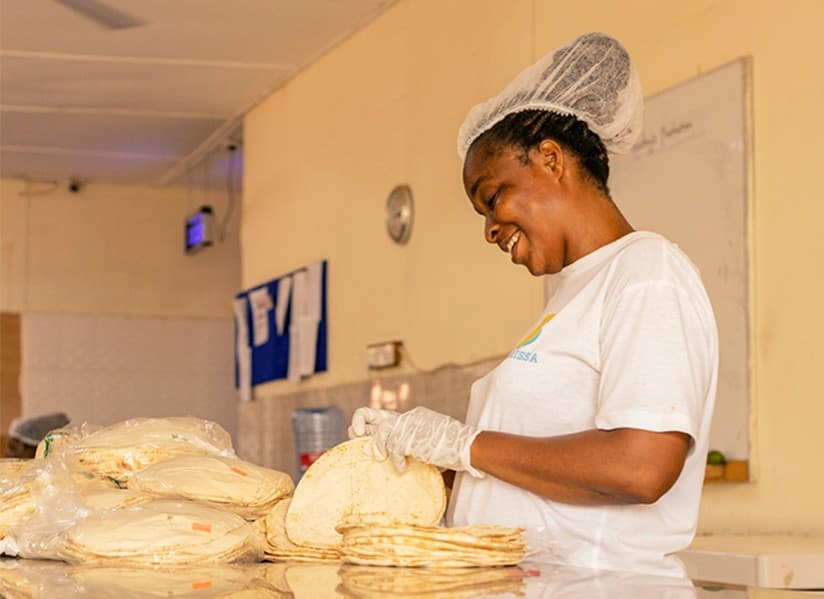 A Basilissa kitchen team member preparing flatbreads